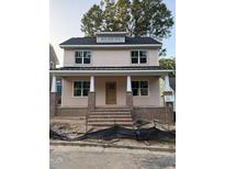 Charming two-story home with a welcoming front porch and brick accents at 2654 Lawndale, Durham, NC 27705