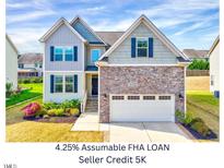 Beautiful two-story home featuring a stone facade and a two-car garage at 3338 Prospect Parkway Pkwy, Durham, NC 27703