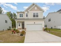Charming two-story home with a two-car garage, well-maintained lawn, and inviting curb appeal at 4005 Sierra Pelona Dr, Raleigh, NC 27616
