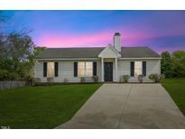 Charming single-story home featuring a well-maintained lawn and inviting curb appeal at 5505 Armada Dr, Raleigh, NC 27610