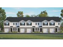Charming townhouse exterior featuring stone accents, attached garages, and manicured landscaping at 102 Red Maple St, Sanford, NC 27332