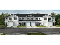 New townhome construction featuring multi-tone exteriors, attached garages, and professionally landscaped front lawns at 10573 Brookside Reserve St, Raleigh, NC 27614