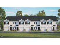 Charming townhome featuring a modern facade, well-manicured lawn, and attached garages at 108 Red Maple St, Sanford, NC 27332