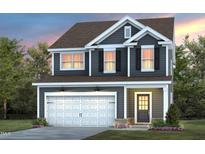 Charming two-story home featuring a white garage door, black shutters, and a well-maintained lawn at 433 Providence Springs Ln, Fuquay Varina, NC 27526
