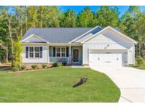 Charming single-story home with a manicured lawn and attached two-car garage at 61 Okra Ct, Selma, NC 27576