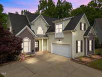 Charming two-story home featuring a neutral color palette, well-manicured landscaping, and an attached two-car garage at 733 Holding Ridge Ct, Wake Forest, NC 27587