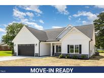Charming exterior showcasing the craftsman style of this move-in ready new construction at 1008 Peedin Rd, Selma, NC 27576