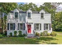 Charming two-story brick home with a bright red front door and neatly landscaped front yard at 1106 Sycamore St, Rocky Mount, NC 27801