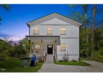 Charming two-story home featuring a welcoming front porch and manicured lawn at 2801 Dearborn Dr # A, Durham, NC 27704