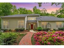 Charming home with meticulously landscaped front yard and brick pathway at 919 Woodham, Pittsboro, NC 27312