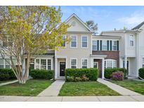 Charming townhome with well-maintained landscaping and classic architectural details at 140 Cedar Elm Rd, Durham, NC 27713