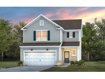 Charming two-story home with gray siding, a two-car garage, and manicured landscaping at 437 Providence Springs Ln, Fuquay Varina, NC 27526