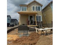 New home under construction featuring a brick foundation and a partially-built front porch at 10 Relaxing Way, Pittsboro, NC 27312
