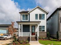 Charming two-story home features a welcoming front porch and appealing modern design at 10 Relaxing Way, Pittsboro, NC 27312