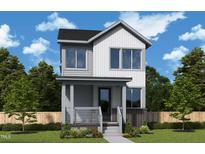 Two story home with gray siding, brick foundation, covered porch, and manicured lawn at 10 Relaxing Way, Pittsboro, NC 27312