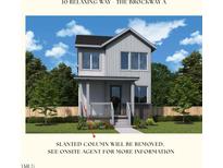 Charming two-story home with a welcoming front porch and neutral siding, nestled in a desirable community at 10 Relaxing Way, Pittsboro, NC 27312