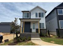 Charming two-story home with brick accents and a welcoming front porch at 10 Relaxing Way, Pittsboro, NC 27312