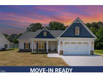 Inviting, move-in ready home with charming architectural details and a well-manicured lawn at 1000 Peedin Rd, Selma, NC 27576