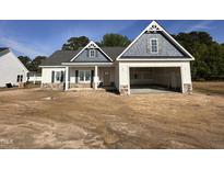 Charming single-Gathering home with an attached garage, complemented by a beautifully designed elevation at 1000 Peedin Rd, Selma, NC 27576