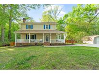 Charming two-story home with a covered front porch and well-maintained lawn at 2004 Valley Ridge Ct, Raleigh, NC 27603