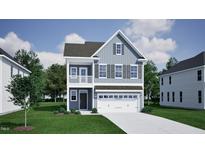 Charming two-story home with a covered porch, and a two-car garage for modern living at 255 Meadowbark Bnd # 31, Garner, NC 27529