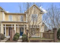 Charming townhome featuring a covered front porch and well-maintained landscaping at 269 Sweet Bay Pl, Carrboro, NC 27510
