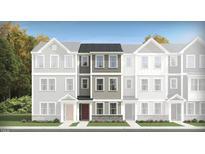 Charming townhouse with gray siding, stone accents, and a welcoming red front door at 336 Carolina Springs Blvd, Apex, NC 27539