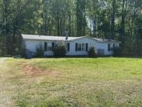 Traditional single-story home with classic siding and a spacious front yard at 4047 Mistletoe Dr, Burlington, NC 27217