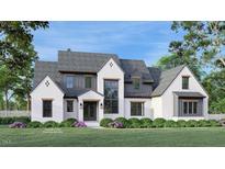 Stunning new construction featuring a white brick facade, gray accents, and professionally landscaped front yard at 97 Fox Oak Trl, Pittsboro, NC 27312