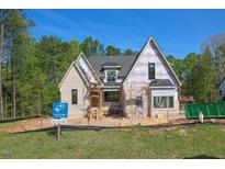 New two-story home under construction showcasing the brick exterior and roof at 2305 Ballywater Lea Way, Wake Forest, NC 27587