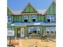 Exterior of a home in progress shows the frame and windows before completion at 3022 White Rail Dr, Fuquay Varina, NC 27526