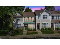 Charming townhome with a well-manicured lawn and inviting curb appeal at 5318 Crescentview Pkwy, Raleigh, NC 27606