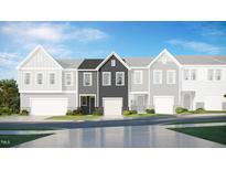 Newly constructed townhome with a stone and siding exterior and a one-car garage at 6010 Grey Colt Way, Durham, NC 27703
