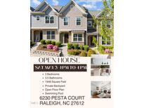 Charming townhomes featuring beautiful landscaping and covered front entryway, perfect for welcoming guests at 6230 Pesta Ct, Raleigh, NC 27612