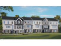 Charming townhome featuring gray siding, stone accents, and a welcoming entrance at 766 Dorset Stream Dr, Fuquay Varina, NC 27526