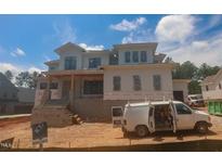 New two-story home with a porch and visible construction features at 7961 Wexford Waters Ln, Wake Forest, NC 27587