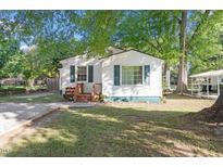 Charming single-story home with a well-maintained lawn and inviting front porch at 116 W Mciver St, Zebulon, NC 27597
