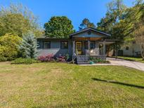 Charming single-story home featuring a cozy front porch and well-manicured lawn at 1317 Kelly Rd, Garner, NC 27529