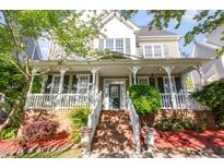Charming home featuring a welcoming front porch and manicured landscaping at 161 Fort Jackson Rd, Morrisville, NC 27560