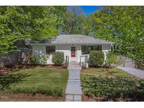 Charming single-story home with a well-manicured lawn and inviting red front door at 1804 N Alston Ave, Durham, NC 27701