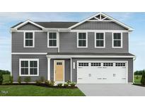 Two-story home with gray siding, a two-car garage, and a well-maintained lawn at 282 N Coral Bells Way, Four Oaks, NC 27524