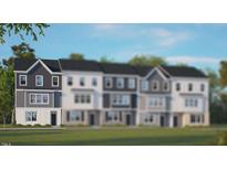 Charming townhome featuring a modern exterior, manicured lawn, and inviting curb appeal at 770 Dorset Stream Dr, Fuquay Varina, NC 27526