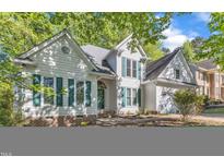 Charming two-story home with green shutters and a well-maintained yard at 8012 Glenbrittle Way, Raleigh, NC 27615