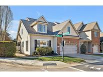 Charming home with a two-car garage, well-maintained lawn, and beautiful landscaping at 103 Aisling Ct, Cary, NC 27513
