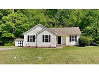 Charming single-story home with neutral siding, black shutters and a well-manicured lawn at 109 Stone Ridge Dr, Smithfield, NC 27577