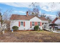Charming single-story home with red shutters, accessible ramp, and brick foundation at 115 Higbee St, Durham, NC 27704