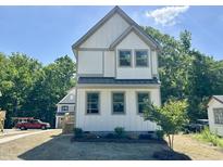 Charming two-story home features a modern design and inviting curb appeal at 1448A Maplewood Dr, Durham, NC 27704