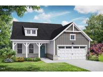 Charming single-Gathering home showcasing a welcoming front porch, two-car garage, and beautifully landscaped yard at 152 Cultivator Ct, Angier, NC 27501