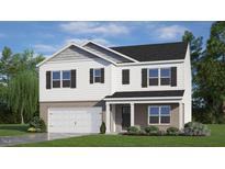 Charming two-story home features brick accents, black shutters, a garage, and a well-manicured lawn at 320 Hanging Elm Ln, Fuquay Varina, NC 27526