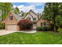 Charming two-story brick home with manicured lawn and mature trees at 524 Birdsong Ln, Hurdle Mills, NC 27541